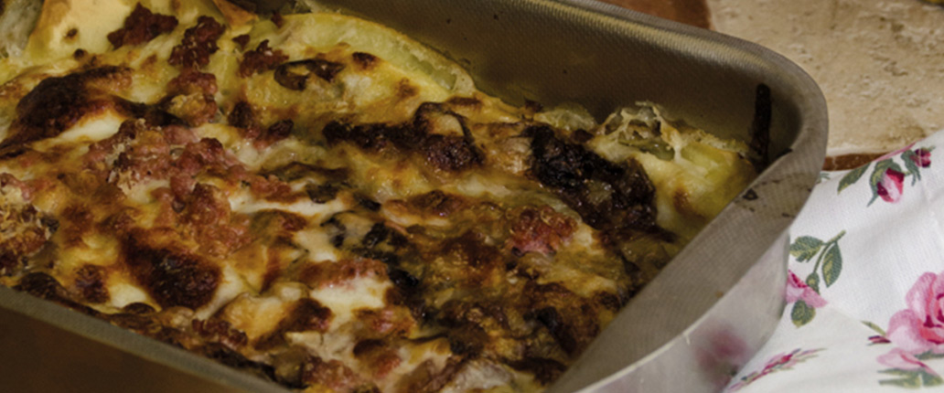 Baked lasagne with Taleggio PDO béchamel sauce, Radicchio Rosso di Treviso PGI and sausage